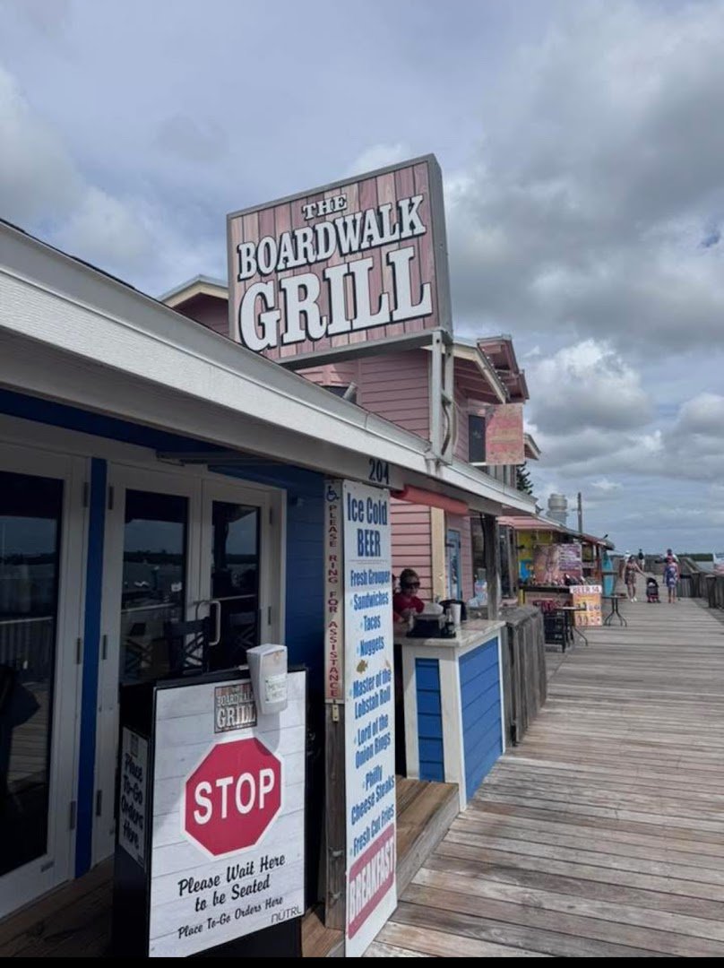 Outdoor patio tables beside the boardwalk.